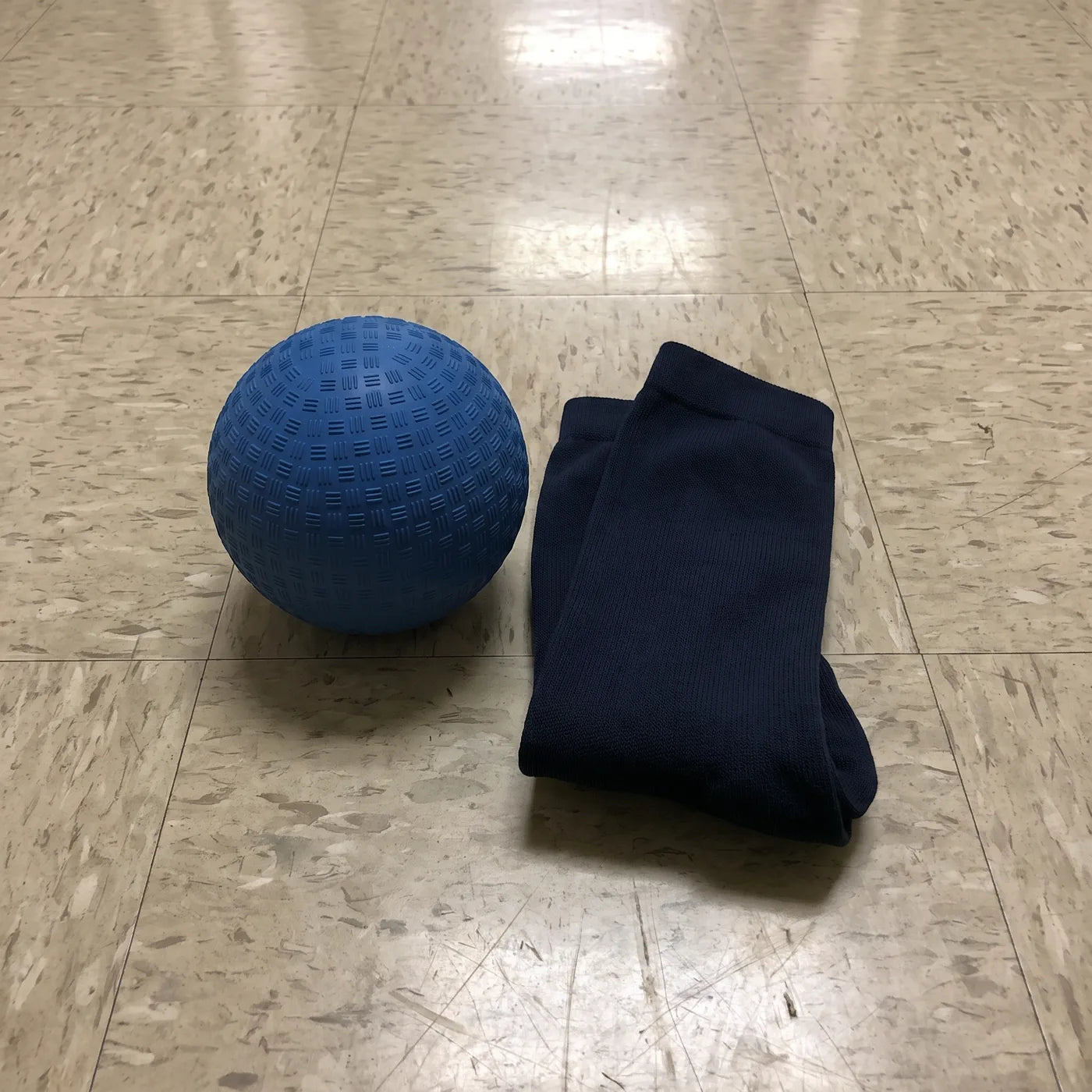 Compression socks and release ball on hospital floor